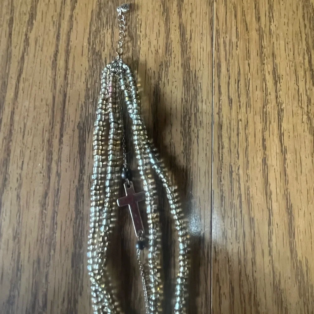 Gold beaded and plated Bracelet with Cross Charm.